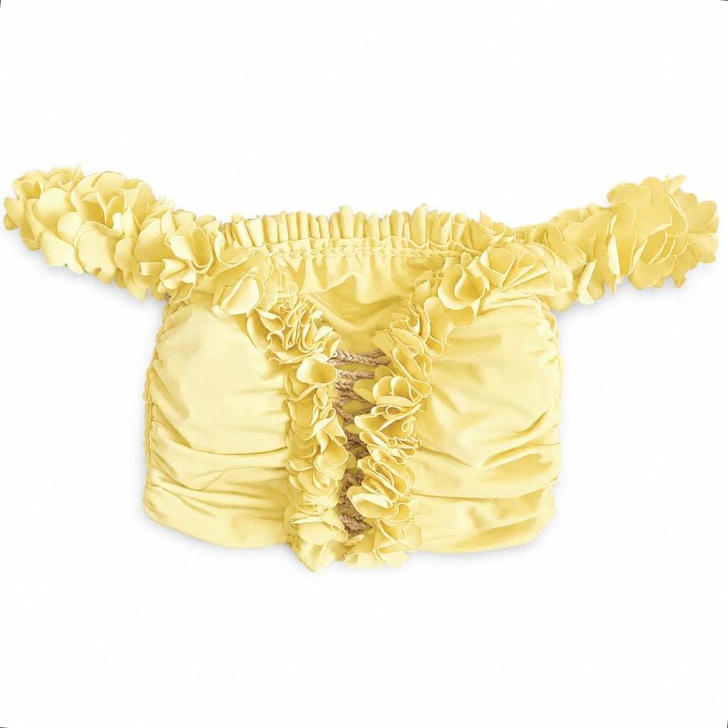 Daffodil light yellow floral off-the-shoulder crop top with flower lei trim and hand-crocheted lace-up center detail.