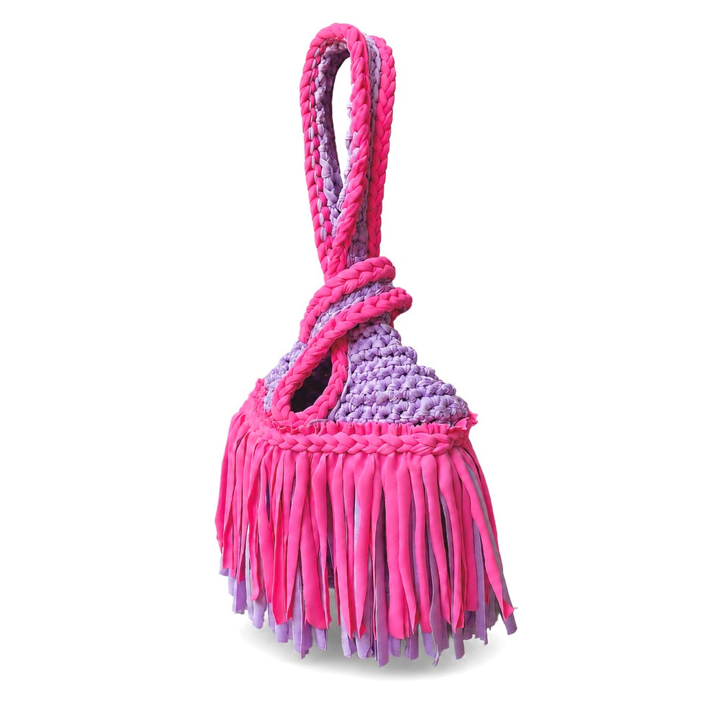 Handmade crochet mini swing bag in Hibiscus pink and Lilac purple with two-tone fringe and a loop-through wristlet handle.