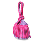 Handmade crochet mini swing bag in Hibiscus pink and Lilac purple with two-tone fringe and a loop-through wristlet handle.
