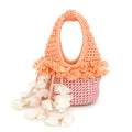Handmade petal pink and poppy orange crochet floral mini bag with magnolia cream cascading petal bells. 