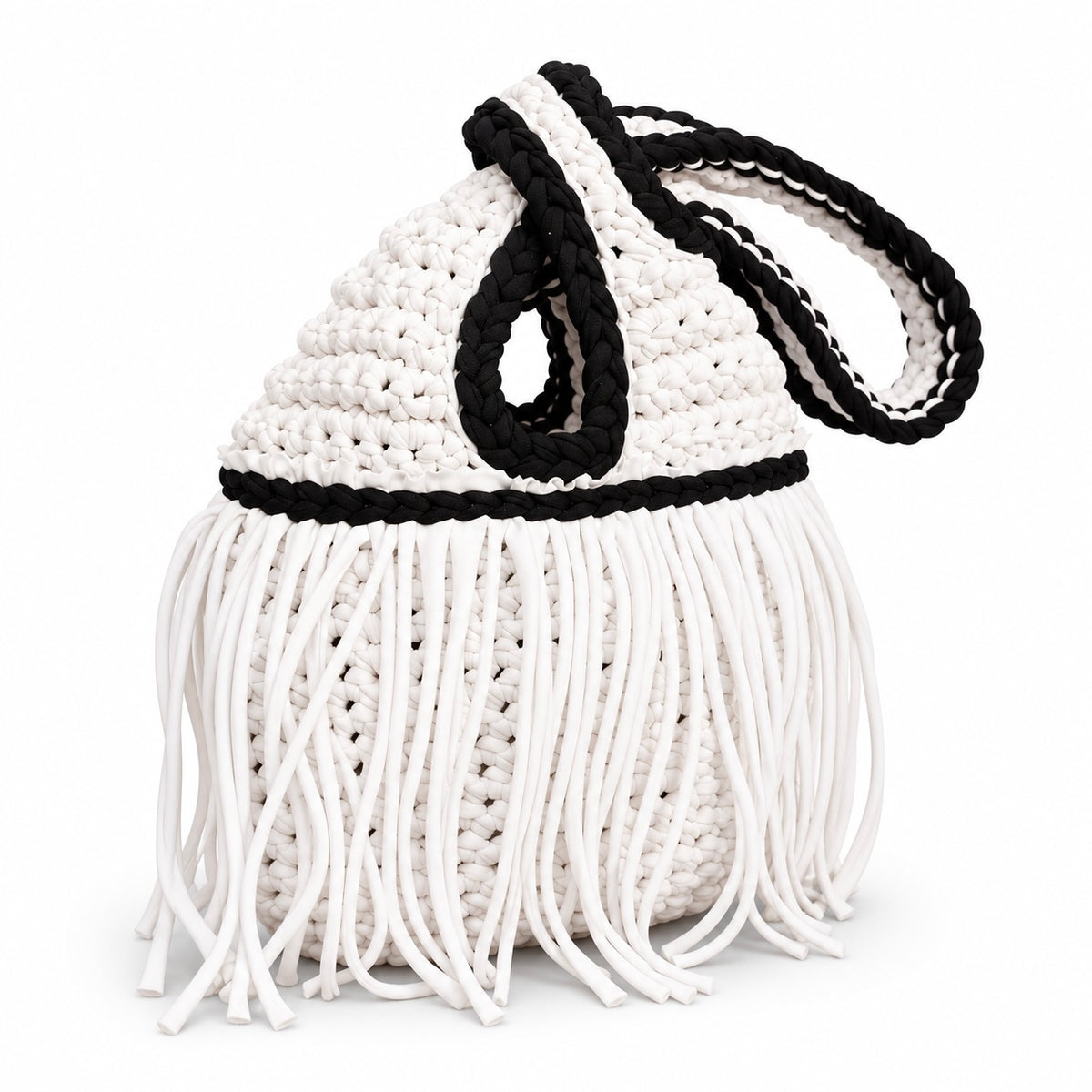 Handmade crochet mini swing bag in Gardenia white with flowing fringe, Onyx black trim and a loop-through wristlet handle.