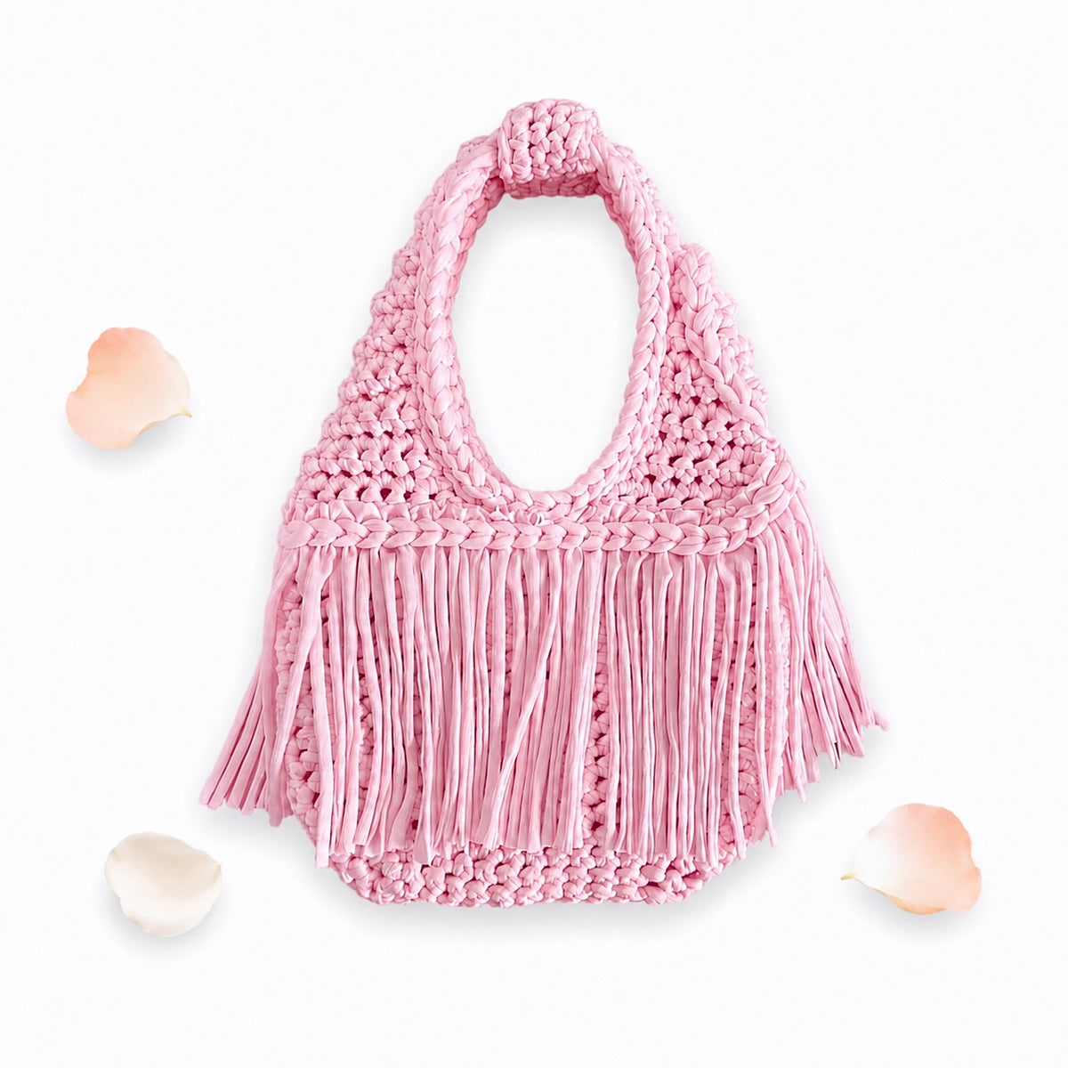 Handmade Petal pink crochet fringe mini bag with flowing fringe and a braided handle.