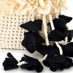 Handmade magnolia cream and onyx black crochet petal bell floral mini bag