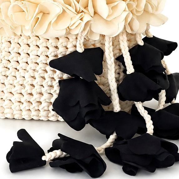 Handmade magnolia cream and onyx black crochet petal bell floral mini bag