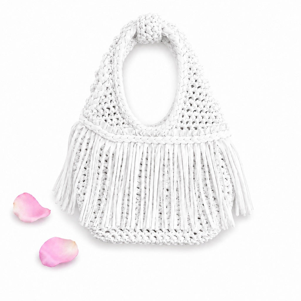 Handmade Gardenia white crochet fringe mini bag with flowing fringe and a braided handle.