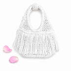 Handmade Gardenia white crochet fringe mini bag with flowing fringe and a braided handle.