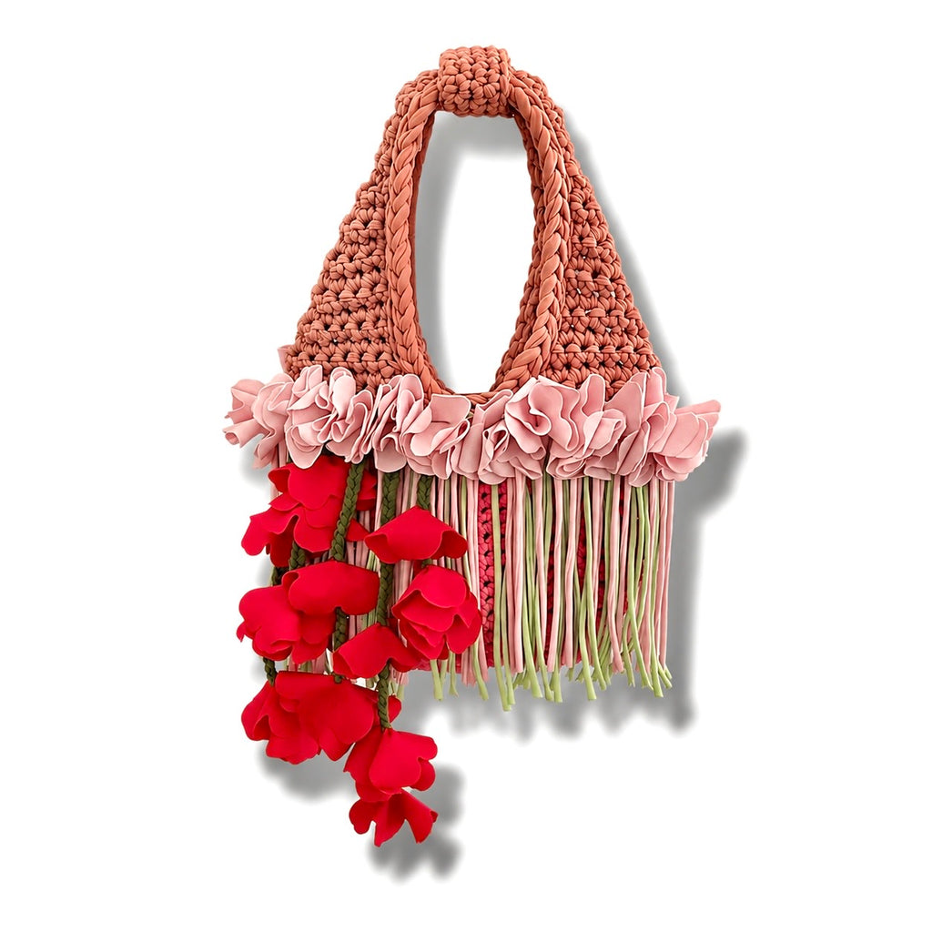 Handmade pink and tan strawberry suede crochet whimsy mini bag with floral fringe and braided tulip red cascading petal bells.