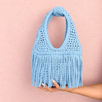 Handmade Hydrangea blue crochet fringe mini bag with flowing fringe and a braided handle.