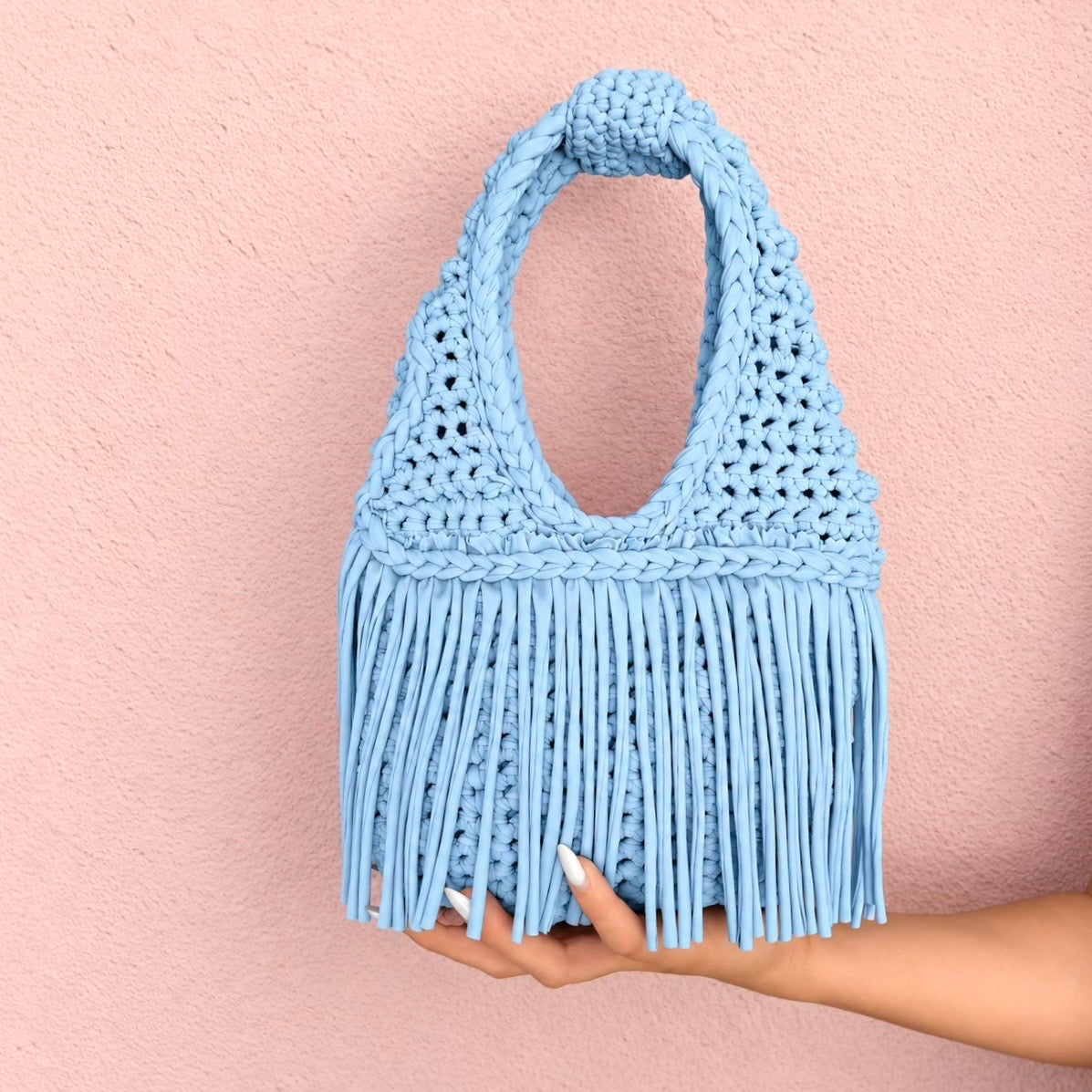 Handmade Hydrangea blue crochet fringe mini bag with flowing fringe and a braided handle.