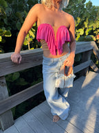Handmade pink coral butterfly ruffle crochet tube top paired with jean pants. 
